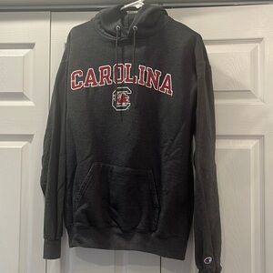 Can be unisex University of Carolina Gamecocks hooded sweatshirt. Dark grey.
